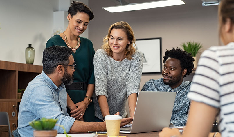 An office team in discussion at a table